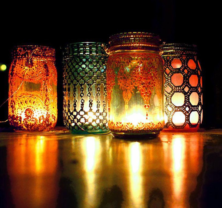 Candles inside mason jar with detailed lace embellishment for a Bohemian look