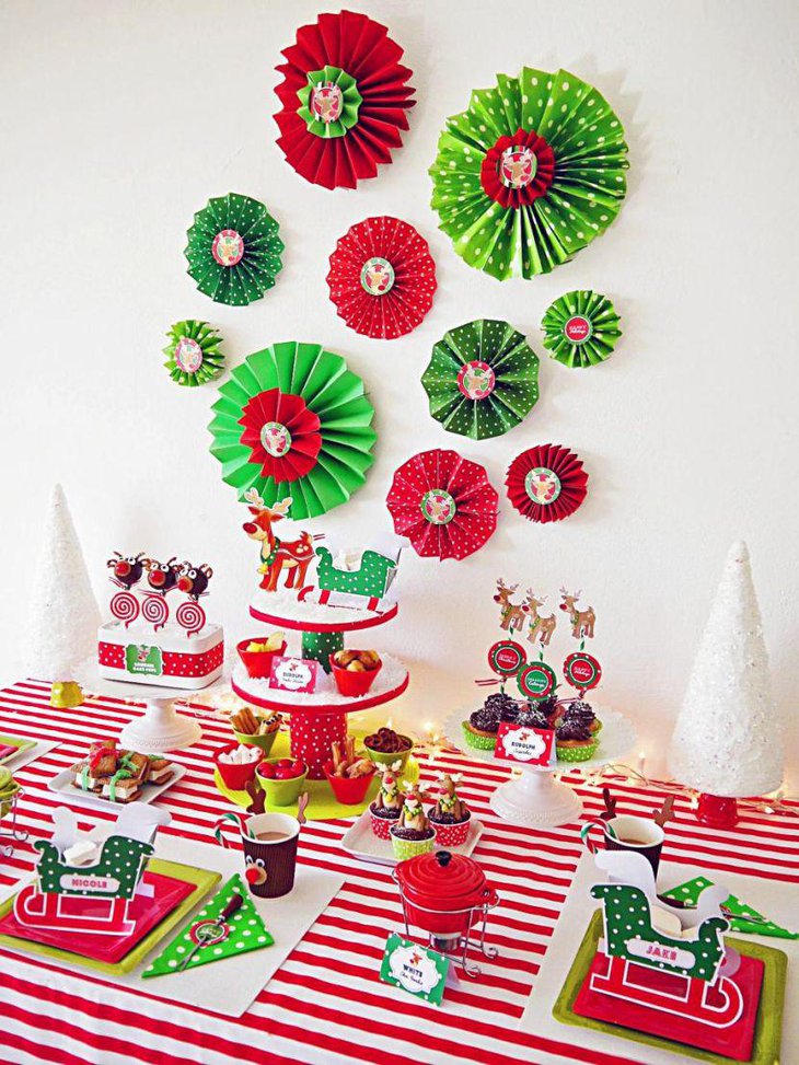 Cheerful kids Christmas dessert table with reindeers