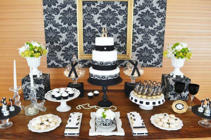 Chic 70th birthday table decor with black and white Damask theme