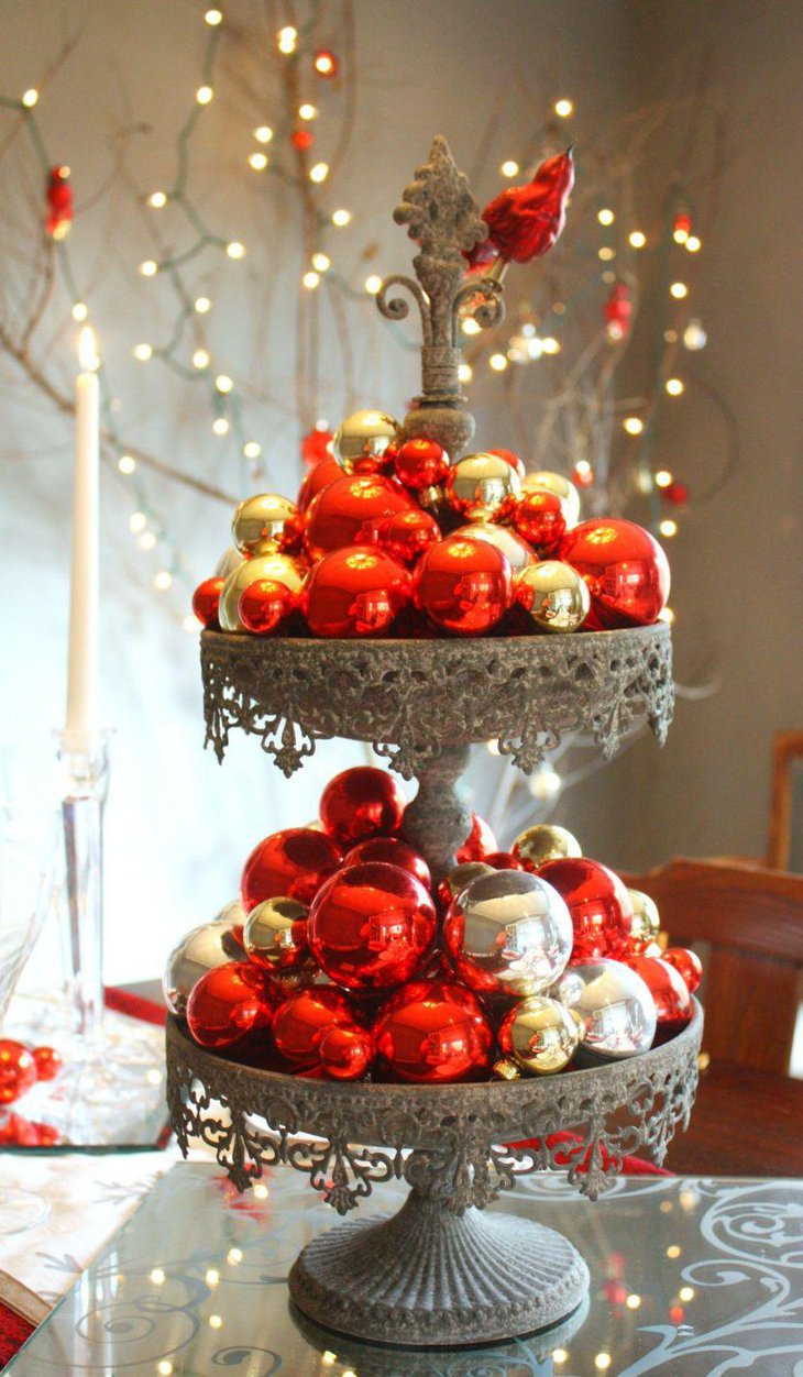 Christmas Tablescape With Red Baubles Filled In Tiered Silver Metal Holder