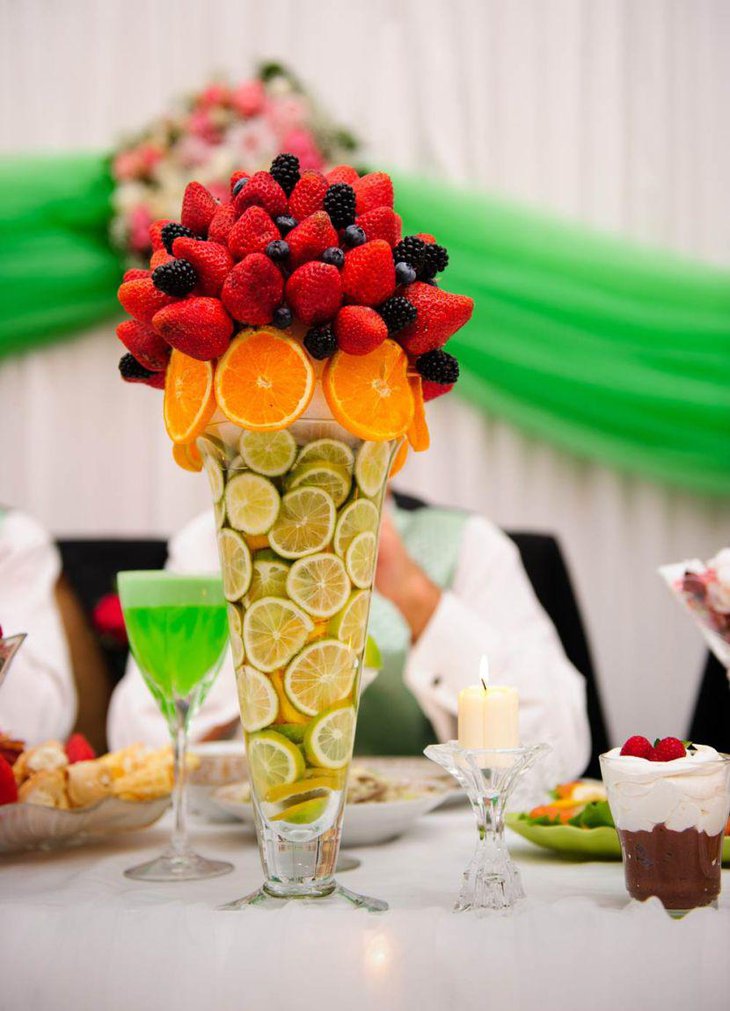 Citrus and berry summer wedding centerpiece