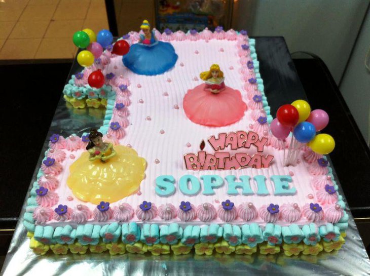 Colorful Disney princess first birthday cake