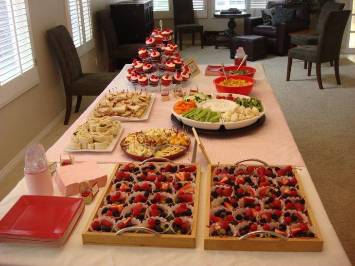 Colorful fruit table for baby shower jungle theme