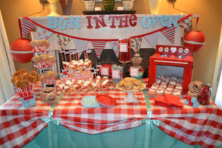 Colourful bun in the oven themed dessert table decor