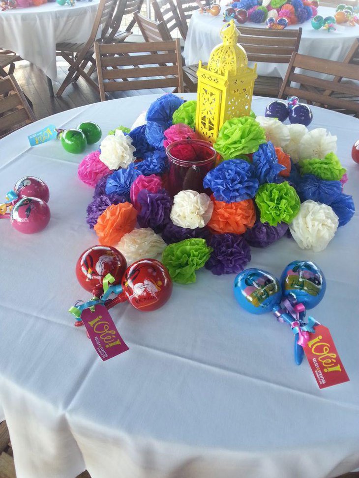 Colourful tissue paper flowers and yellow lantern decor