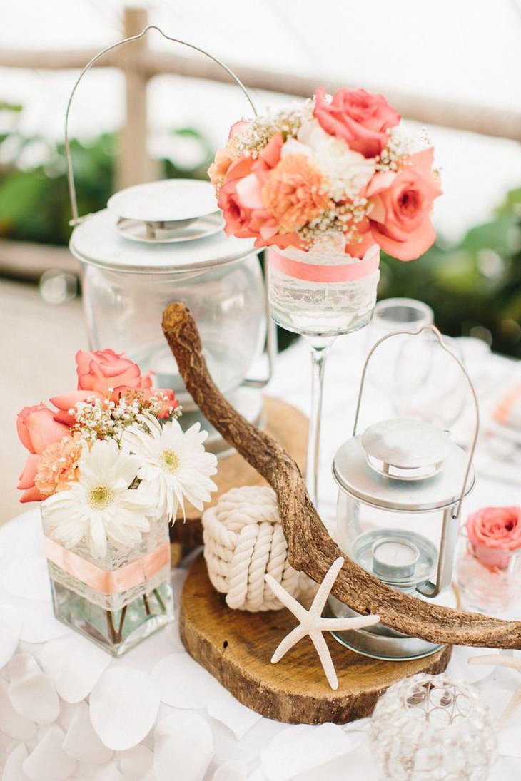 Coral pink rose centerpiece for a beach theme wedding table