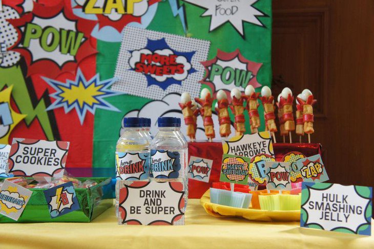 Cute Avengers themed candy table with display of fun foods