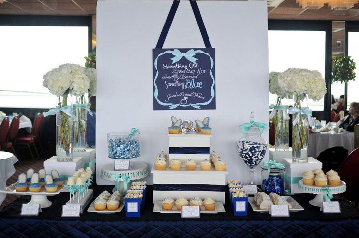 Cute blue themed bridal shower dessert table decor
