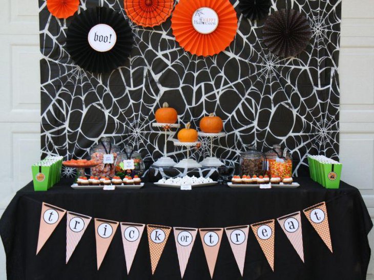 Cute DIY pumpkins decorated on white stands