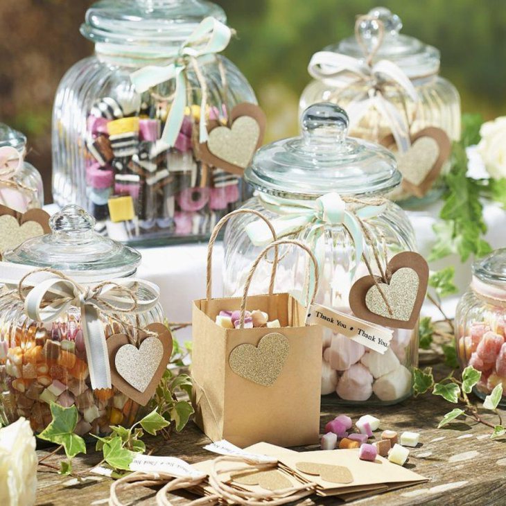 Cute DIY wedding candy table decor with paper candy bag and heart shaped tassles
