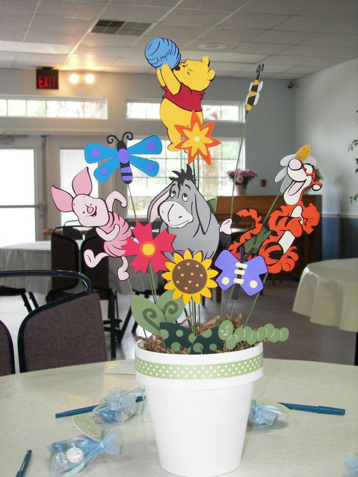 Cute DIY Winnie The Pooh baby shower bucket centerpiece