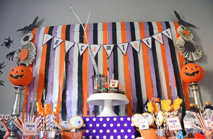 Cute Pumpkins on silver stands for kids Halloween treats table