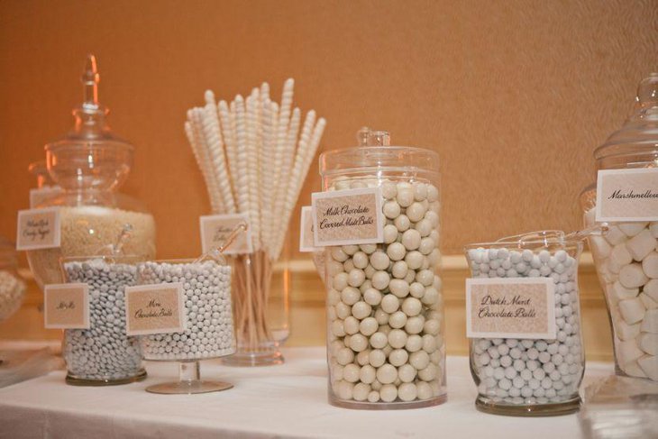 Cute white wedding candy buffet table