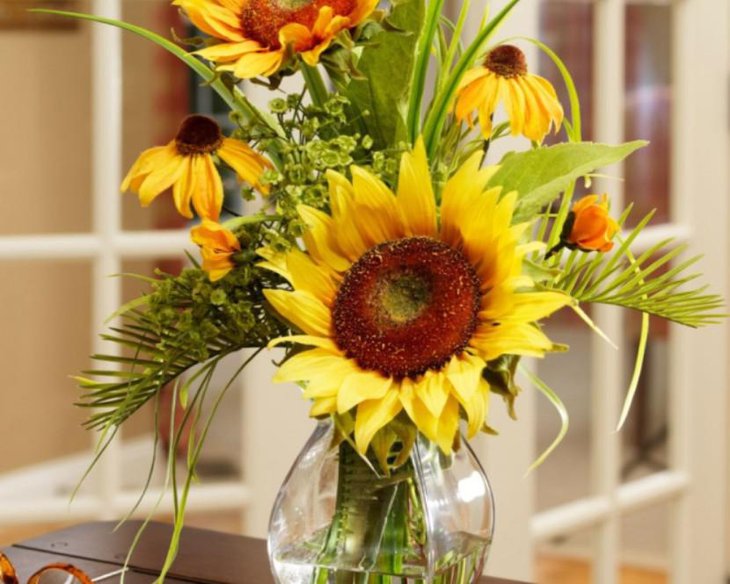 Dazzling Solid Wood Dining Table Decoration Using Yellow Sunflowers With Green Leaves Stem