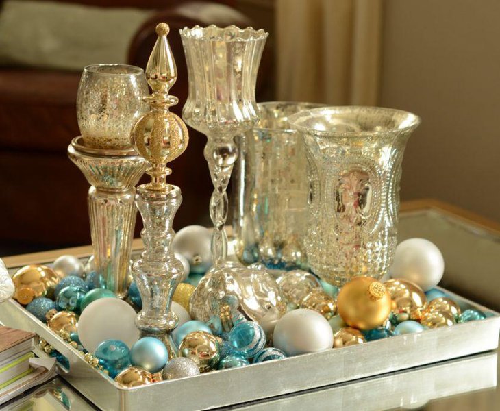 Decorative gold and silver accented vase votives holders with balls vignette