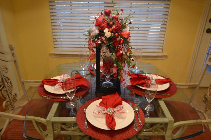 Dining table centerpiece with beautiful lantern with candle and hearts