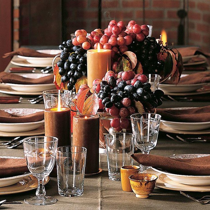 Dining table decor with grapes and berries as centerpiece