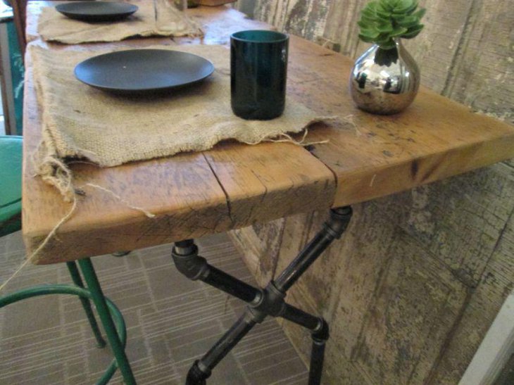 DIY dining table made out of pipes and wood