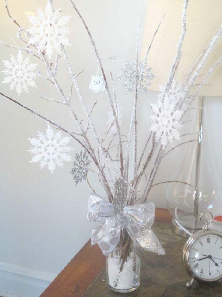 DIY icy branch centerpiece on winter wonderland table