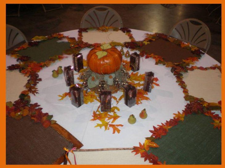 DIY table decoration with pumpkin and maple leaves