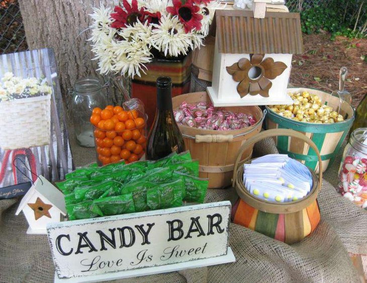 DIY wedding candy bar table with flowers and burlap