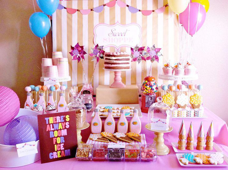 DIY wedding candy table idea with paper pinwheel decorations