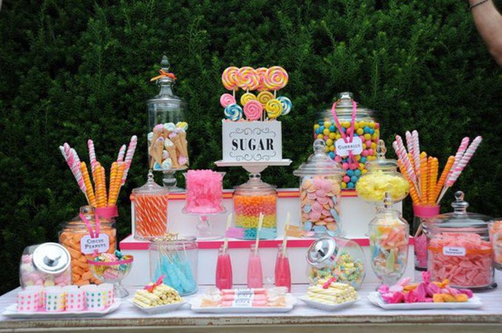 DIY wedding candy table with yellow pink and orange accents