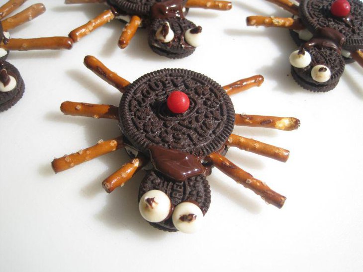 Edible black widow spider decorations on kids Halloween table