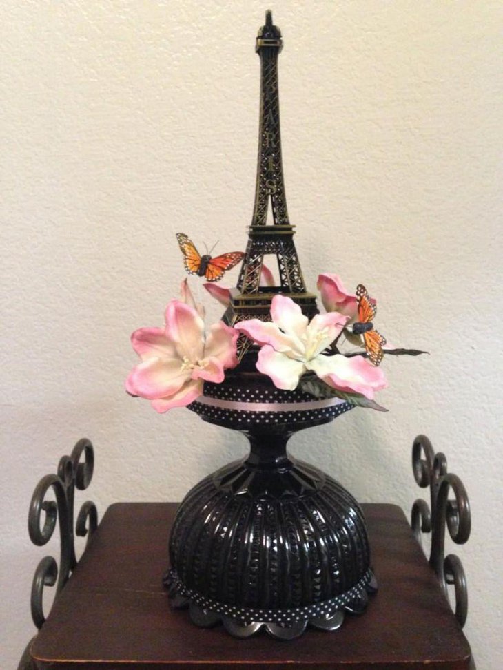 Eiffel Tower centerpiece with flowers and butterflies