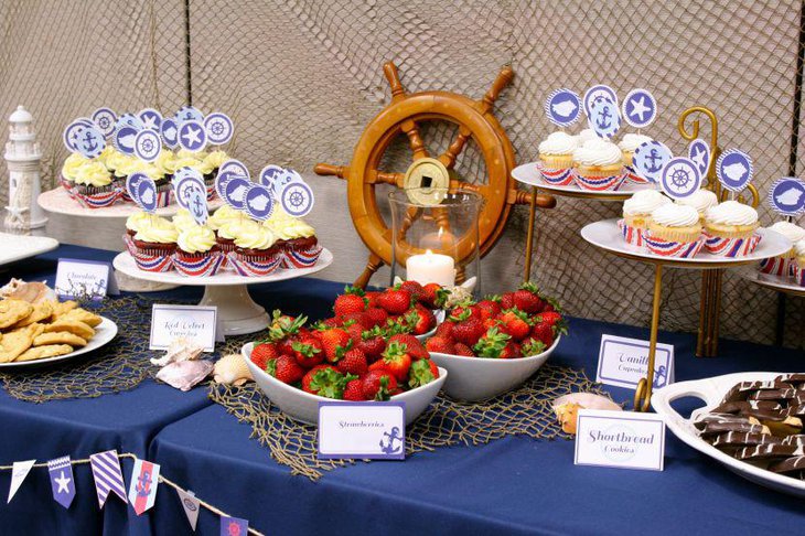 Enticing blue nautical baby shower food table decor idea