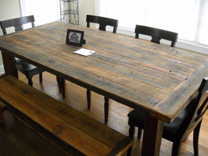 Farmhouse style DIY dining table made out of reclaimed wood