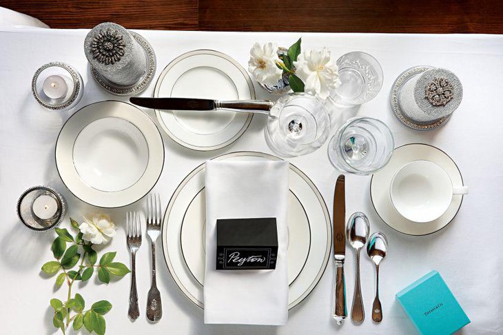 Formal white party table setting with silver candles and white rose