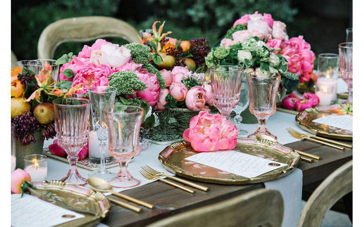 Fruits and flowers deck this Italian themed table