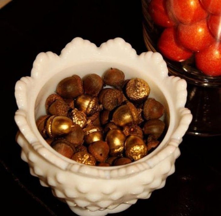 Golden Acorn Filled White Bowl As Table Centerpiece
