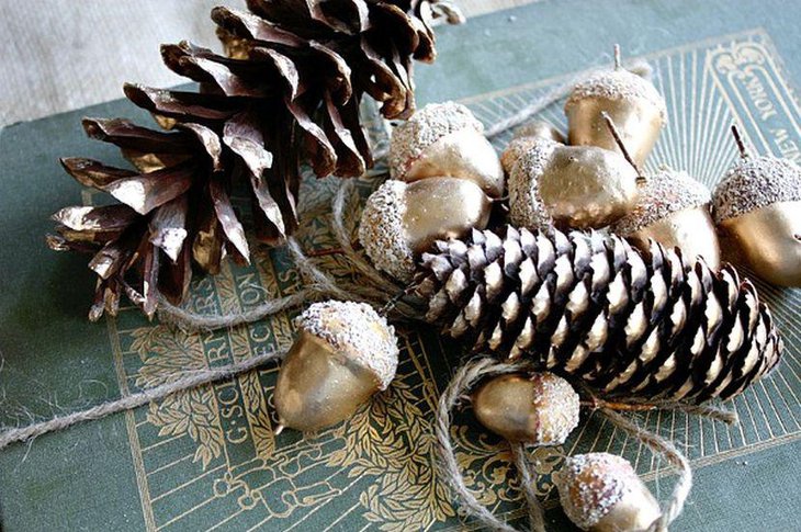 Golden Coloured Acorns With Pines As Table Centerpiece