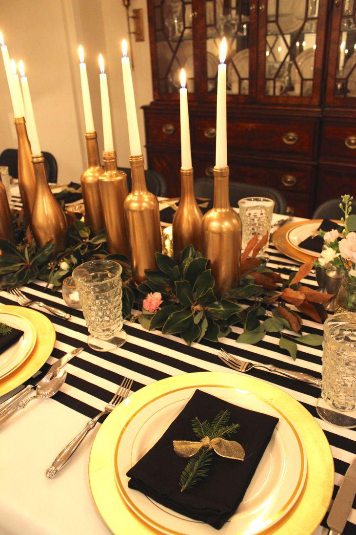 Golden DIY bottles with candles on wedding table
