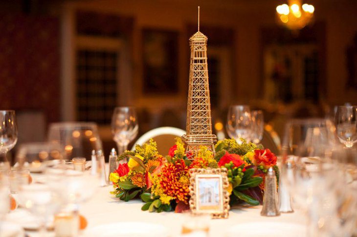 Golden Eiffel Tower centerpiece and flower decor