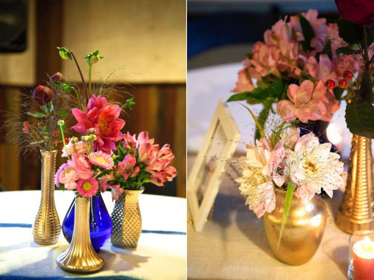 Golden themed floral vase decor on wedding table