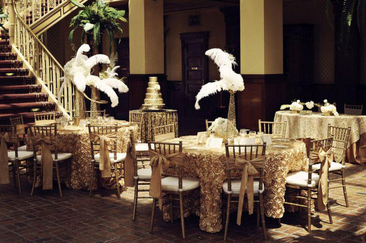 Golden wedding vase centerpiece with feathers