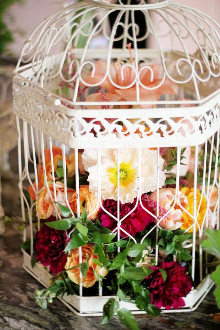 Gorgeous birdcage centerpiece with tulips and carnations
