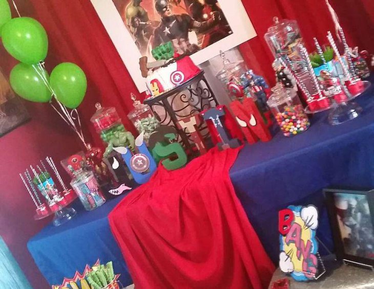 Gorgeous cake and candies on Avengers birthday candy table for kids
