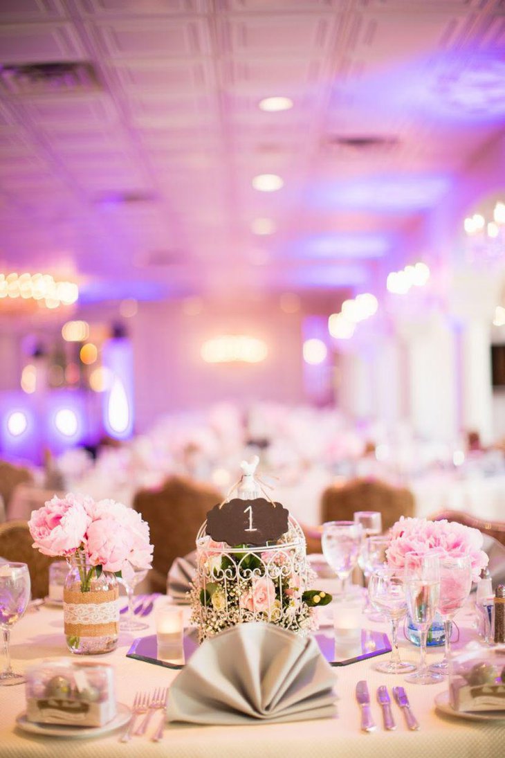 Gorgeous DIY birdcage centerpiece filled with seasonal flowers