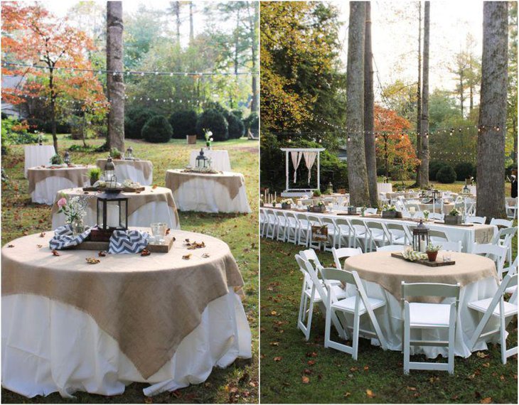 Gorgeous outdoor country wedding table decor with lanterns wood and candles