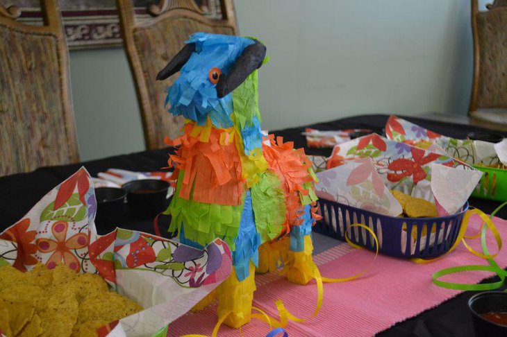 Gorgeous pinata centerpiece decking up this Mexican food table