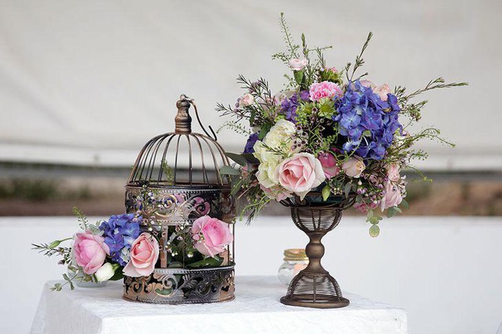 Gorgeous rustic floral birdcage centerpiece