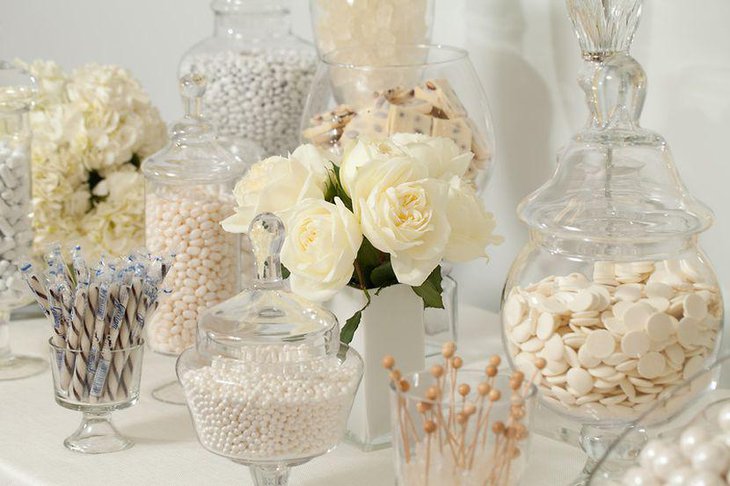 Gorgeous white wedding candy buffet table