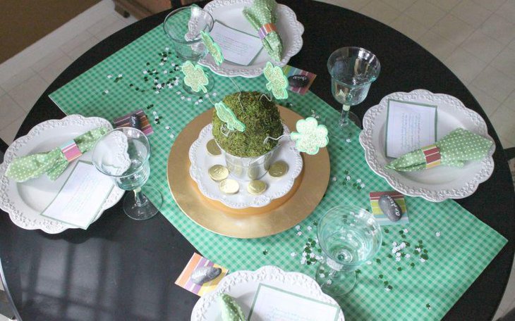 Green grass in bucket decorated with paper flowers for table centerpiece