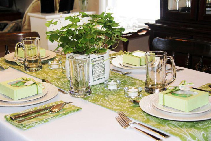 Green leaves in square glass table centerpiece for St Patricks Day