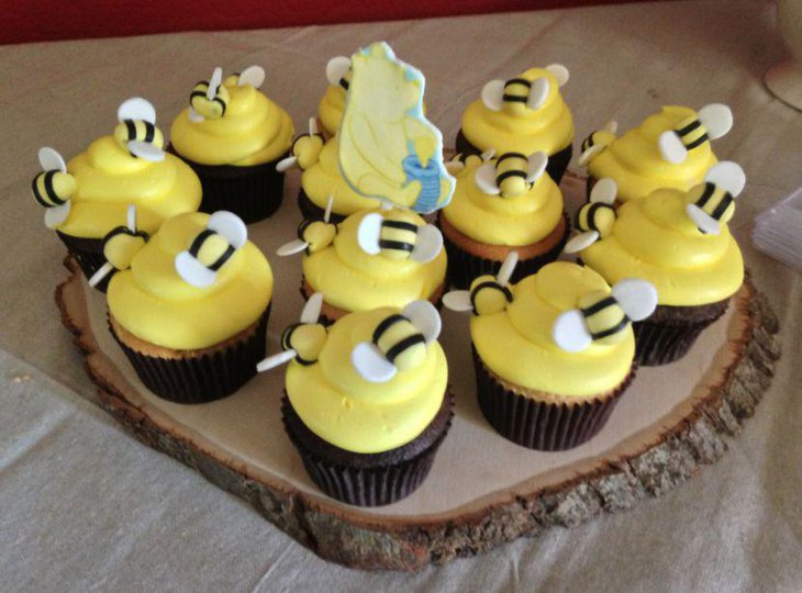 Hunny vanilla cupcakes on Winnie The Pooh baby shower table 1