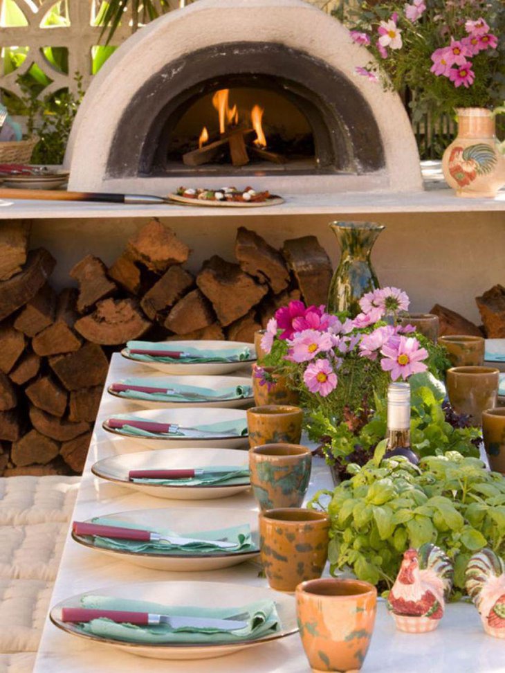 Italian patio table decoration with greens and flowers